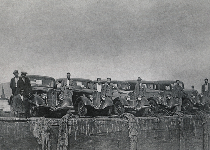 Cars dockside in black and white