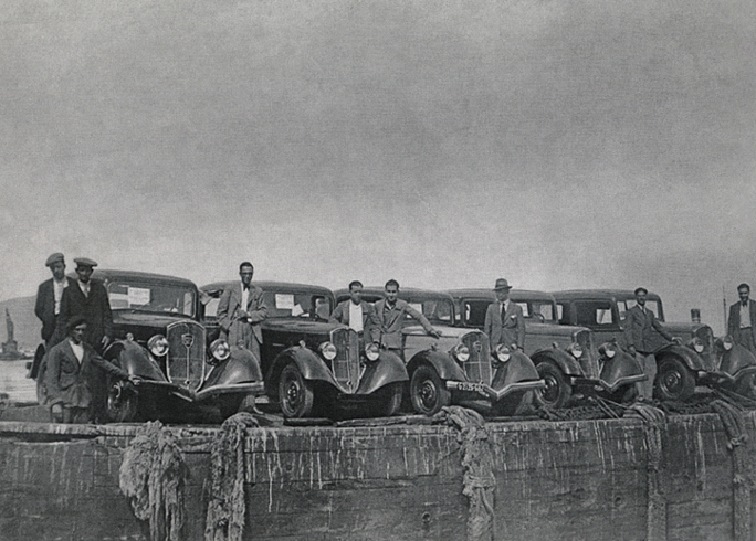 Cars dockside in black and white