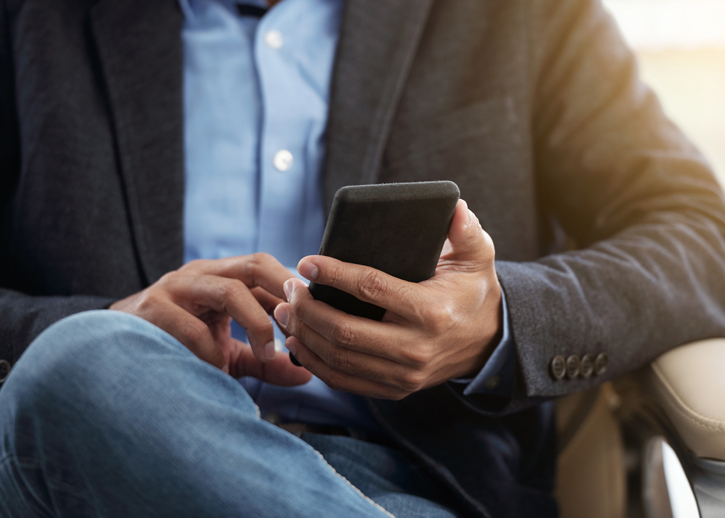 Person holding mobile phone