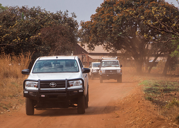 TGS trucks driving on a dust road