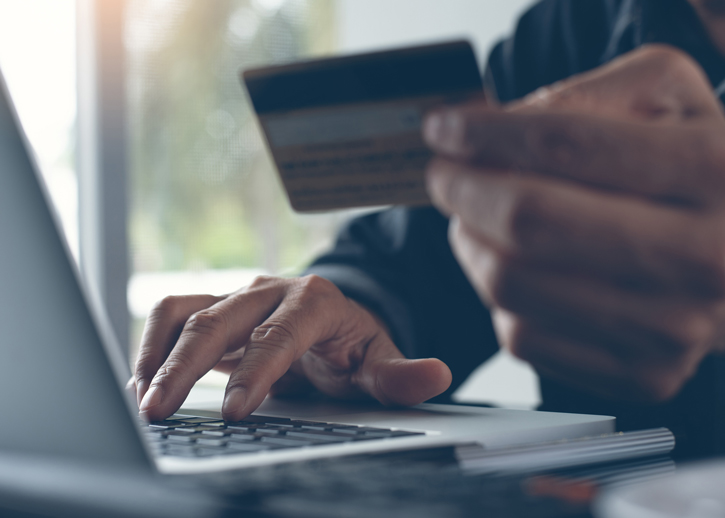 Person inputting card details to his computer