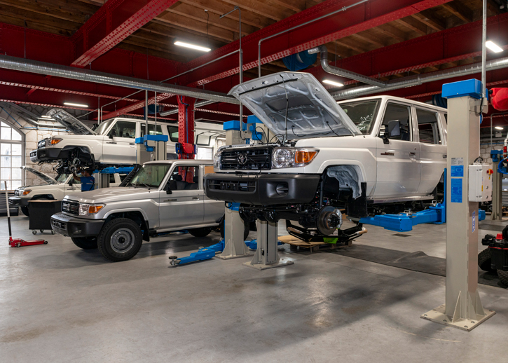 TGS Trucks suspended on ramps in the factory