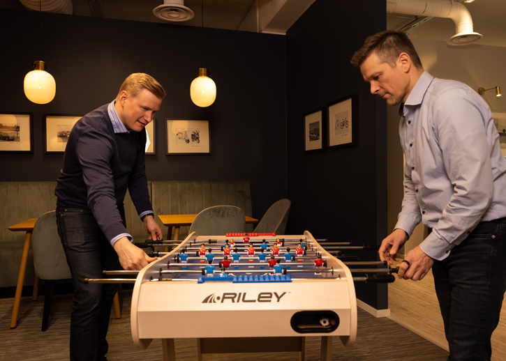 Two people playing table football 