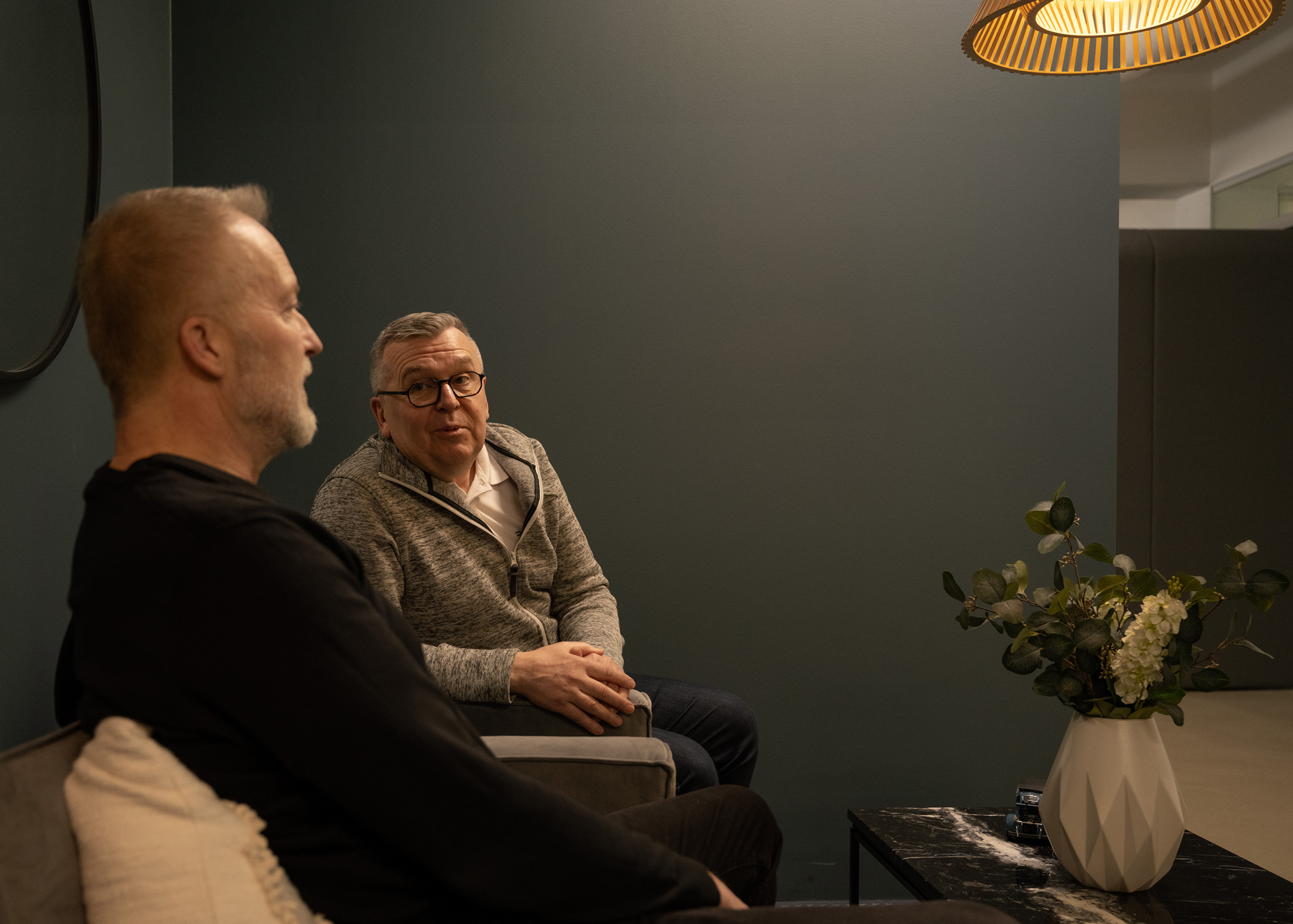 Two people having conversation in casual area 