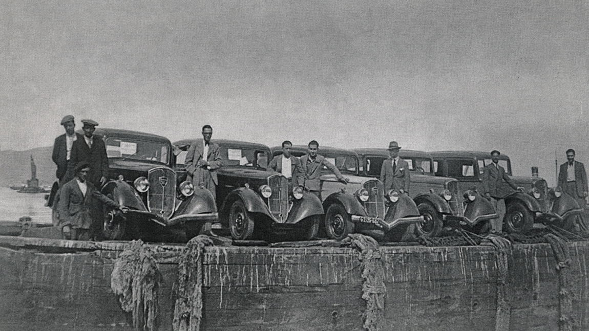 Cars dockside in black and white